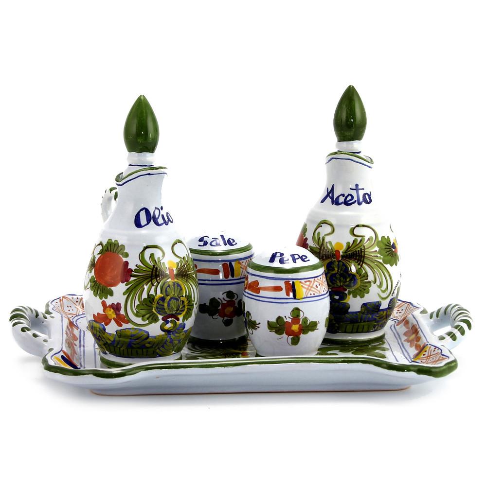 Handcrafted Italian ceramic oil, vinegar, salt, and pepper set from the Faenza Garofano collection, featuring intricate green and orange floral patterns.