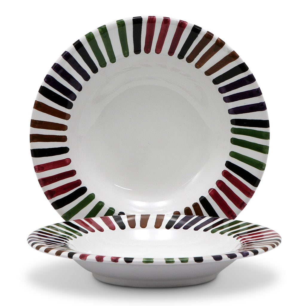 Handcrafted Italian ceramic plate set from the Bello collection, featuring colorful striped patterns.